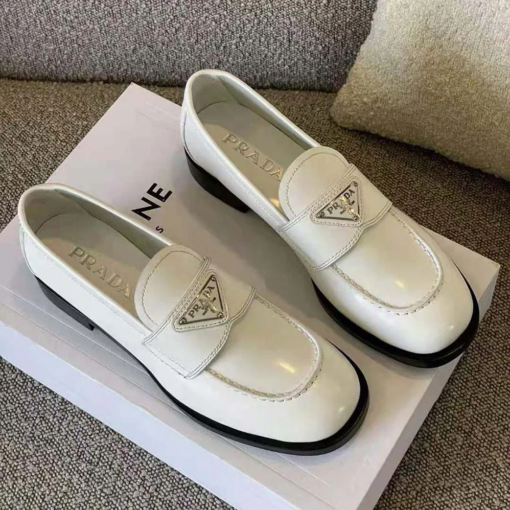 Prada Patent Leather Loafers in 25 mm Heel Height for Women in White Prada Patent Leather Loafers in 25 mm Heel Height for Women in White