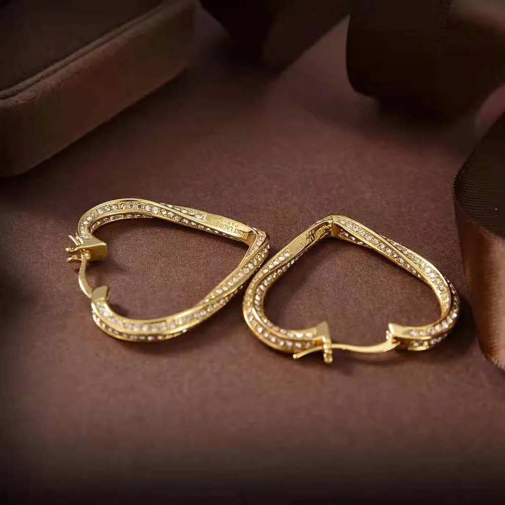 Saint Laurent YSL Smoking Twisted Heart Hoop Earrings in Metal and Crystal for Women Saint Laurent YSL Smoking Twisted Heart Hoop Earrings in Metal and Crystal for Women