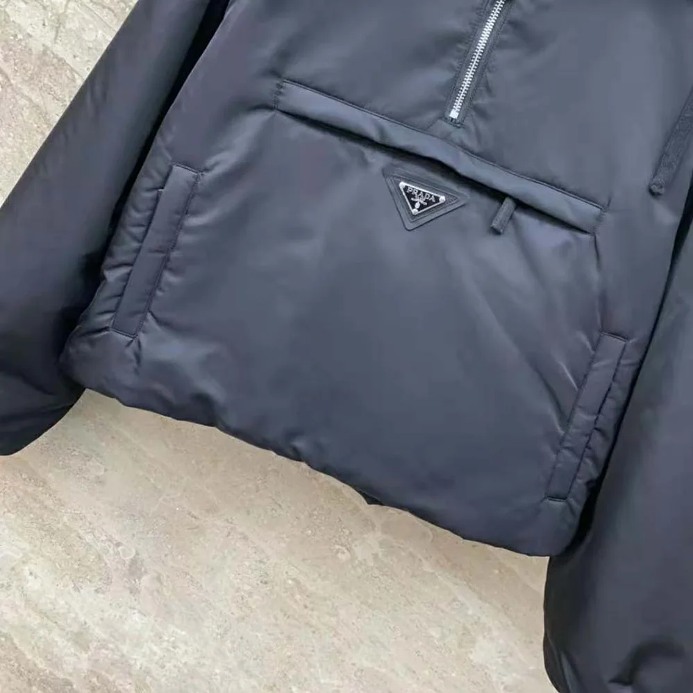 Prada Re-Nylon Blouson Jacket with Enameled Metal Triangle Logo for Women in Black Prada Re-Nylon Blouson Jacket with Enameled Metal Triangle Logo for Women in Black