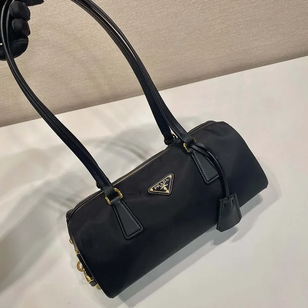 Prada Re-Nylon and Leather Medium Top-handle Bag with Padlock for Women in Black Prada Re-Nylon and Leather Medium Top-handle Bag with Padlock for Women in Black