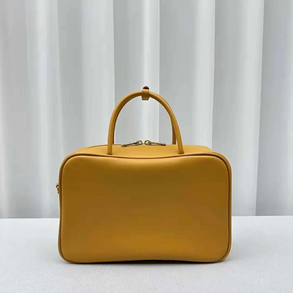 Miu Miu Leather Top-handle Bag with Embossed Lettering Logo for Women in Orange Miu Miu Leather Top-handle Bag with Embossed Lettering Logo for Women in Orange