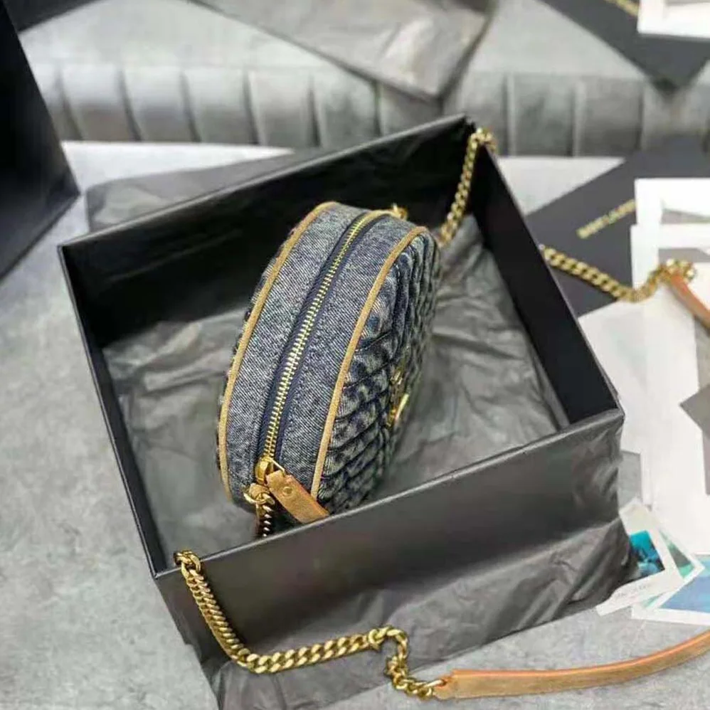 Saint Laurent YSL Vinyle Round Camera Bag in Chevron for Women in Quilted Denim and Suede Saint Laurent YSL Vinyle Round Camera Bag in Chevron for Women in Quilted Denim and Suede