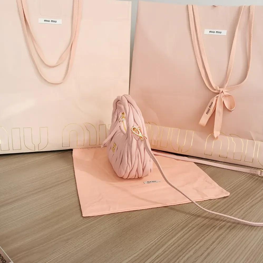 Miu Miu Wander Matelassé Nappa Leather Hobo Mini-Bag for Women in Powder Pink