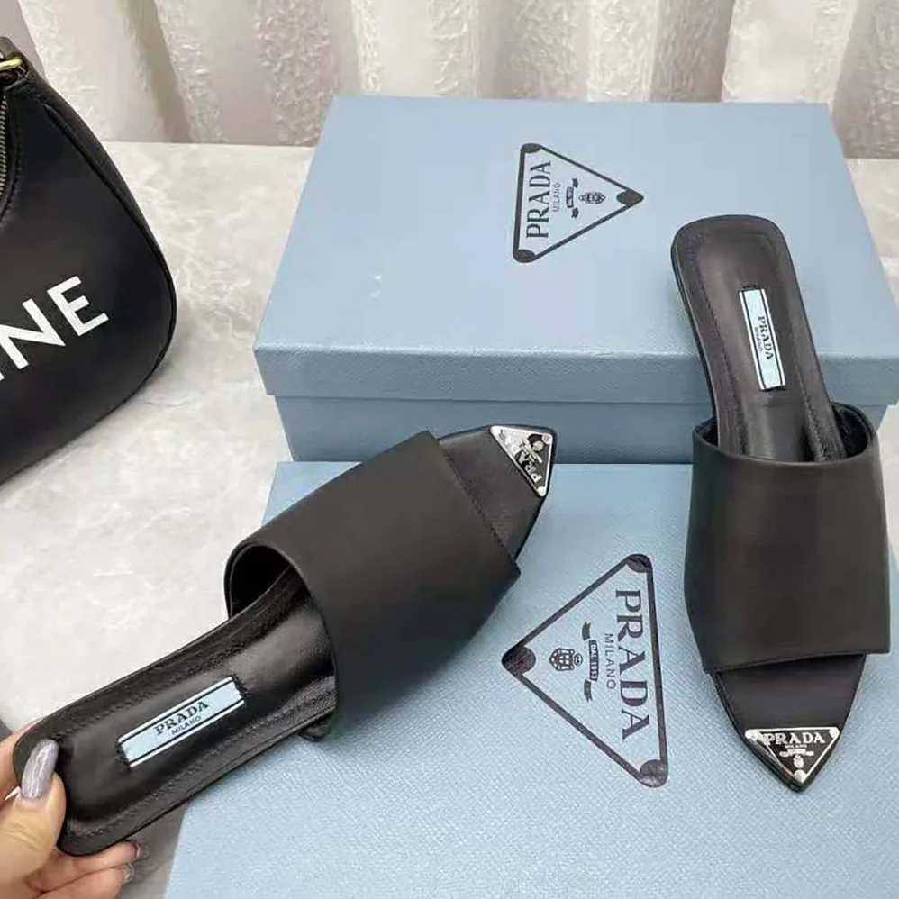 Prada Brushed Leather Slides with a Modernist Line Feature an Unexpected for Women