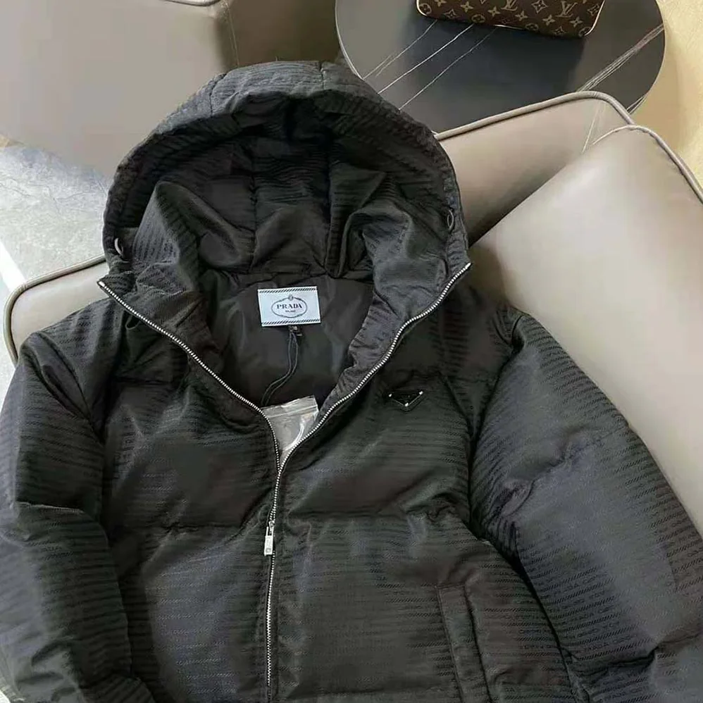 Prada Re-Nylon Hooded Down Jacket for Men in Black Prada Re-Nylon Hooded Down Jacket for Men in Black