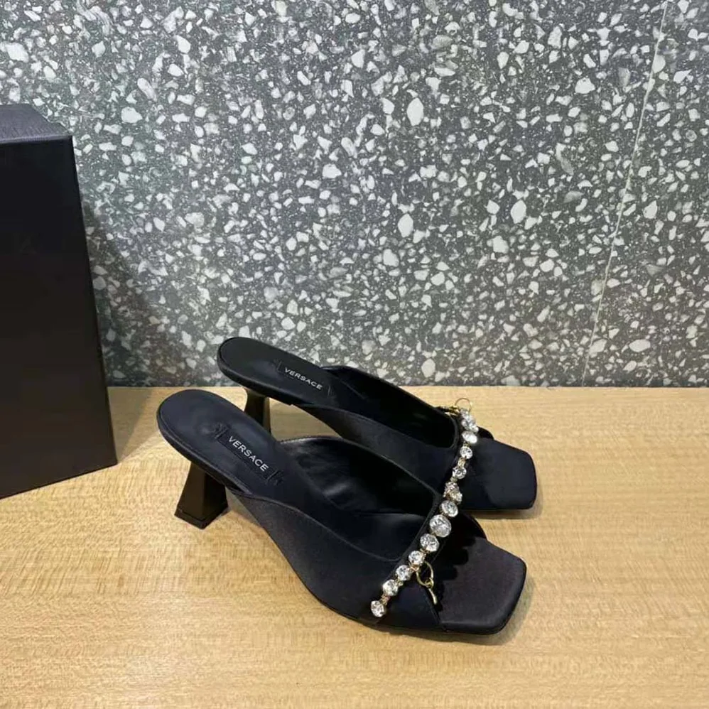 Versace Artifact Mid-Heel Mules for Women in Black Versace Artifact Mid-Heel Mules for Women in Black