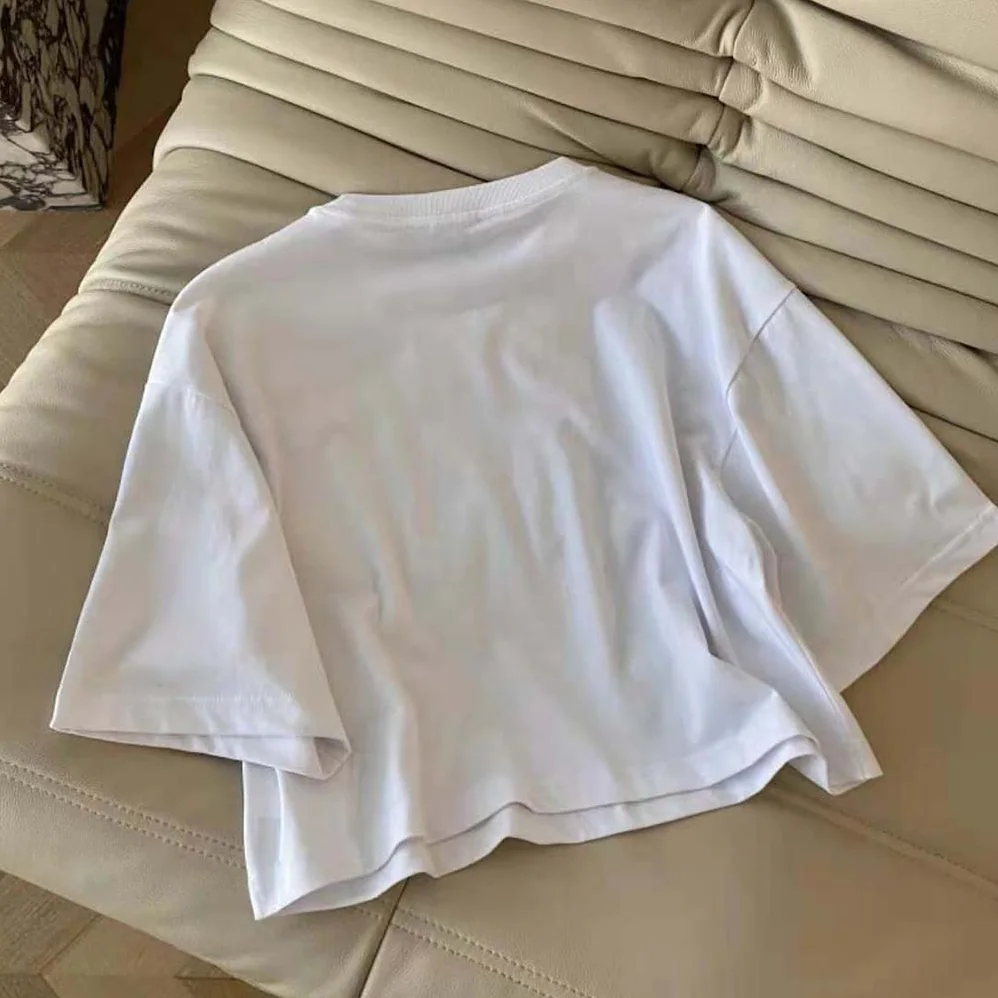 Miu Miu Embroidered Cotton T-shirt with Embroidered Logo for Women in White Miu Miu Embroidered Cotton T-shirt with Embroidered Logo for Women in White