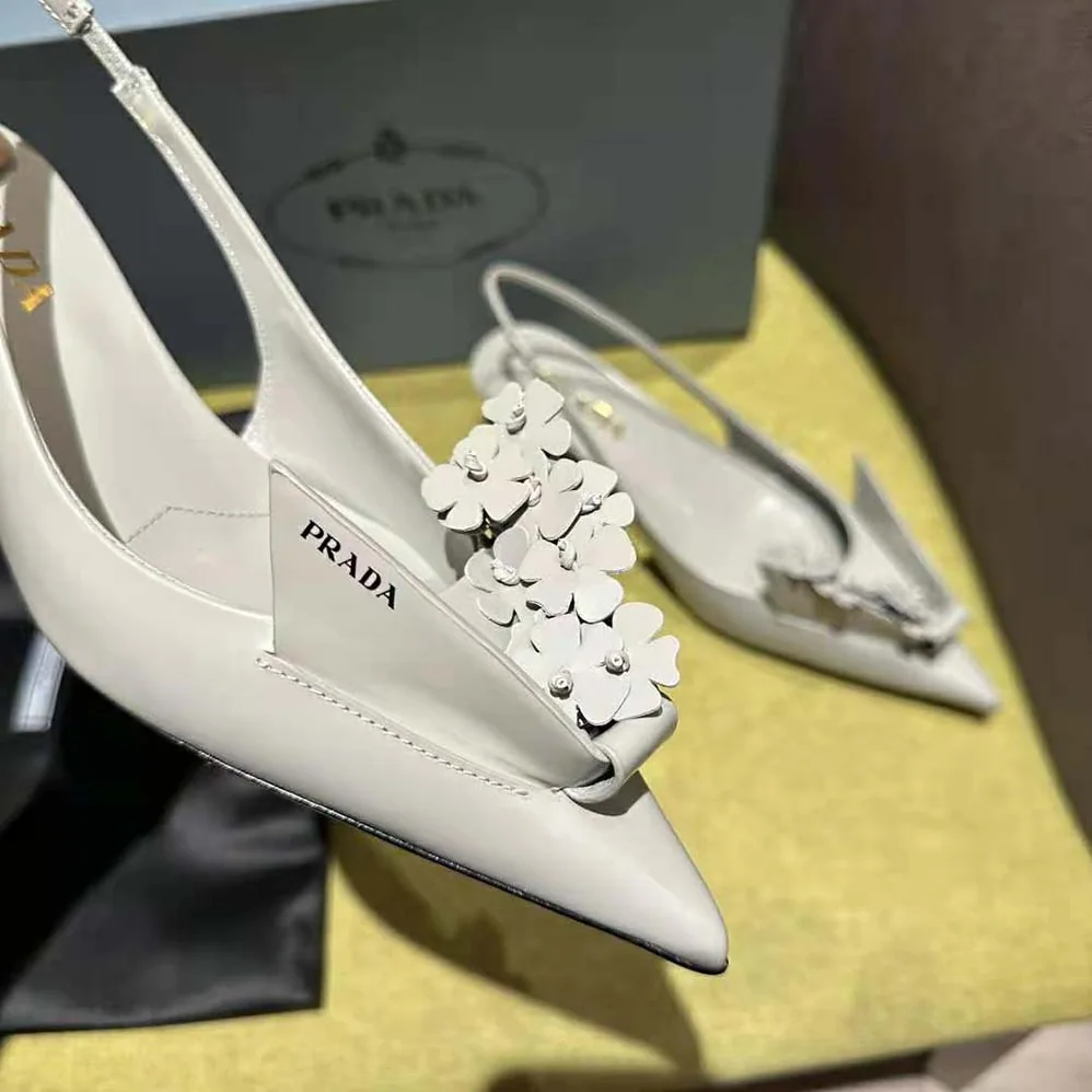 Prada Brushed Leather Slingback Pumps with Floral Appliques for Women in Gray Prada Brushed Leather Slingback Pumps with Floral Appliques for Women in Gray
