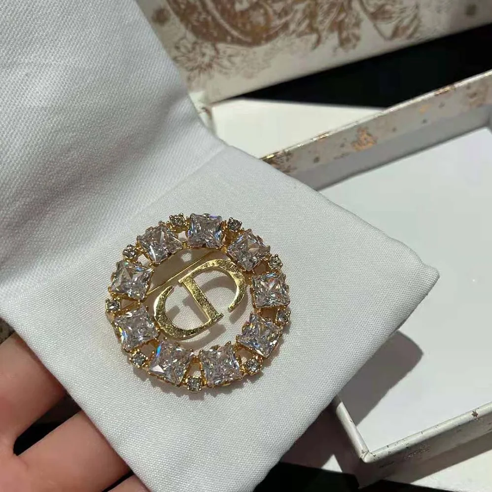 Dior Petit CD Brooch Gold-Finish Metal with White and Silver for Women in Tone Crystals Dior Petit CD Brooch Gold-Finish Metal with White and Silver for Women in Tone Crystals