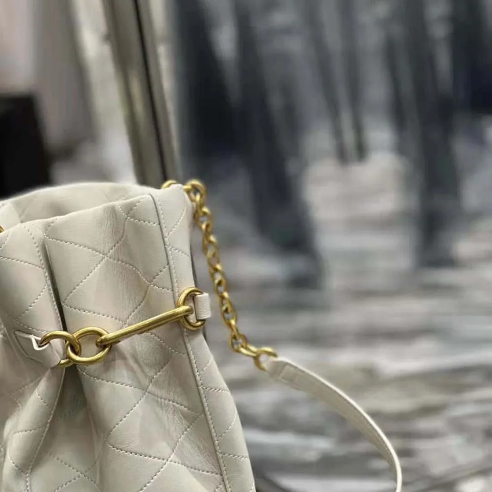 Saint Laurent YSL Le Maillon Hook Bucket Bag in Supple Leather for Women in White Saint Laurent YSL Le Maillon Hook Bucket Bag in Supple Leather for Women in White