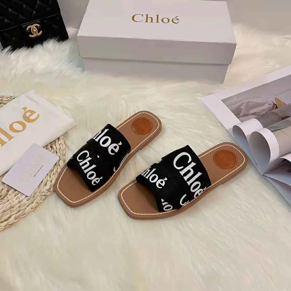 Chloe Woody Flat Mule in Canvas for Women in Black Chloe Woody Flat Mule in Canvas for Women in Black