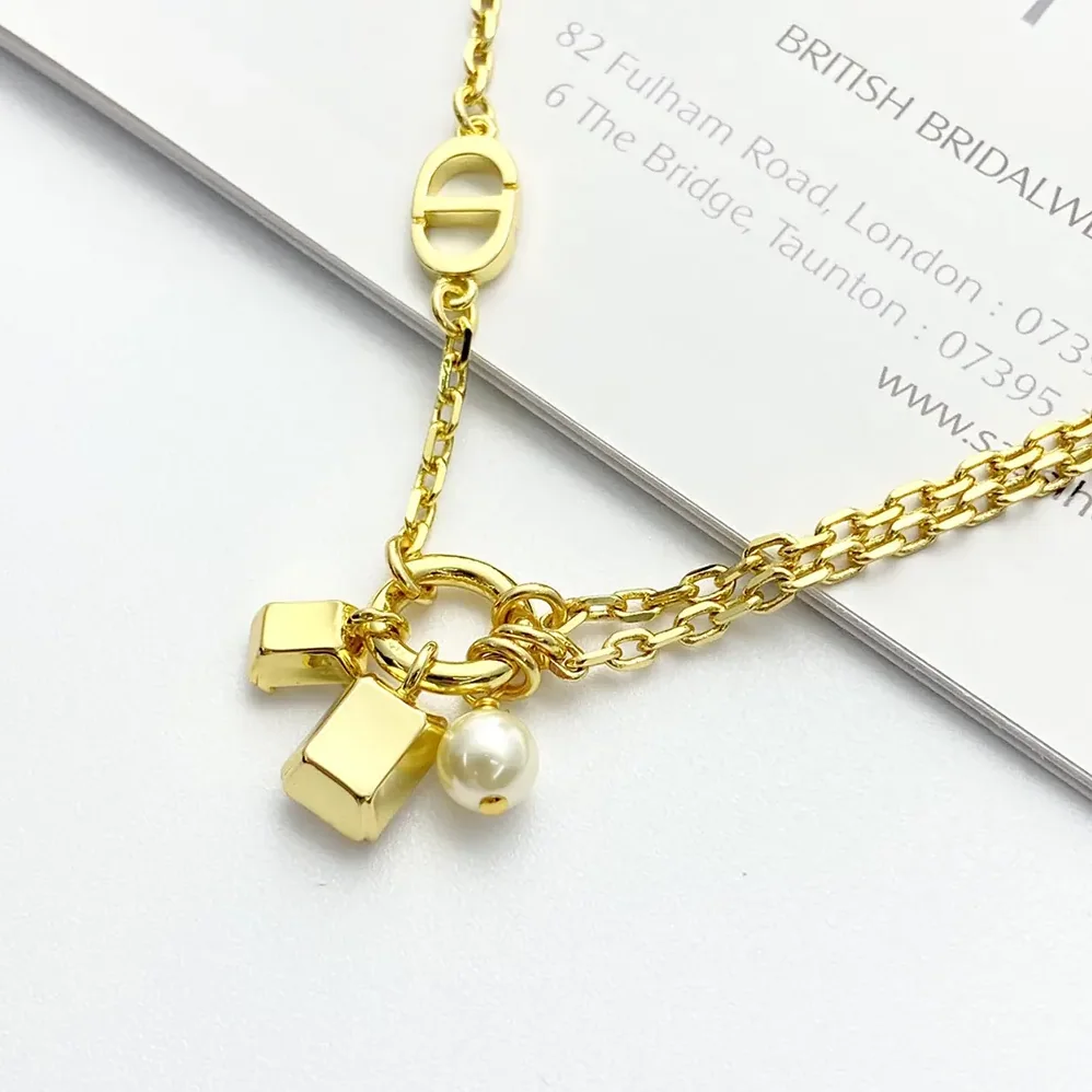 Dior Petit CD Bracelet Gold-Finish Metal with a White Resin Pearl and Silver for Women in Tone Crystals Dior Petit CD Bracelet Gold-Finish Metal with a White Resin Pearl and Silver for Women in Tone Crystals