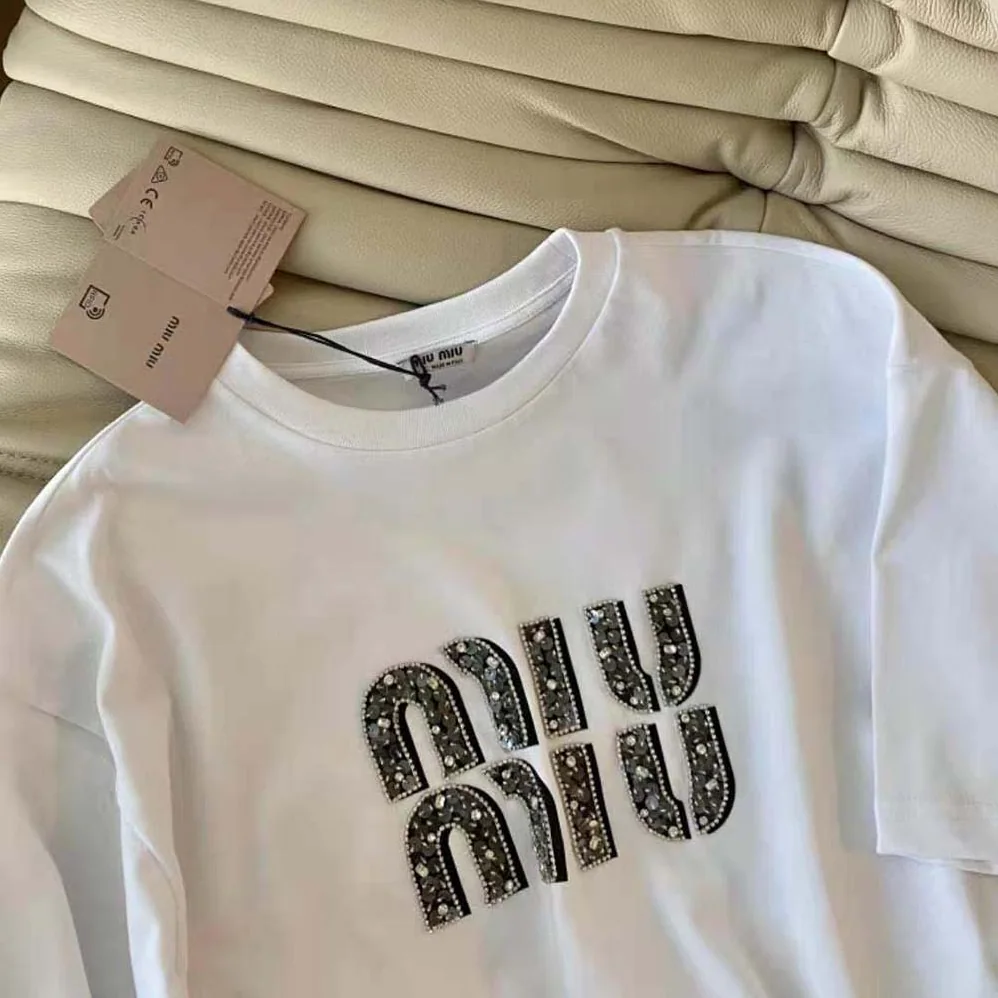 Miu Miu Embroidered Cotton T-shirt with Embroidered Logo for Women in White Miu Miu Embroidered Cotton T-shirt with Embroidered Logo for Women in White