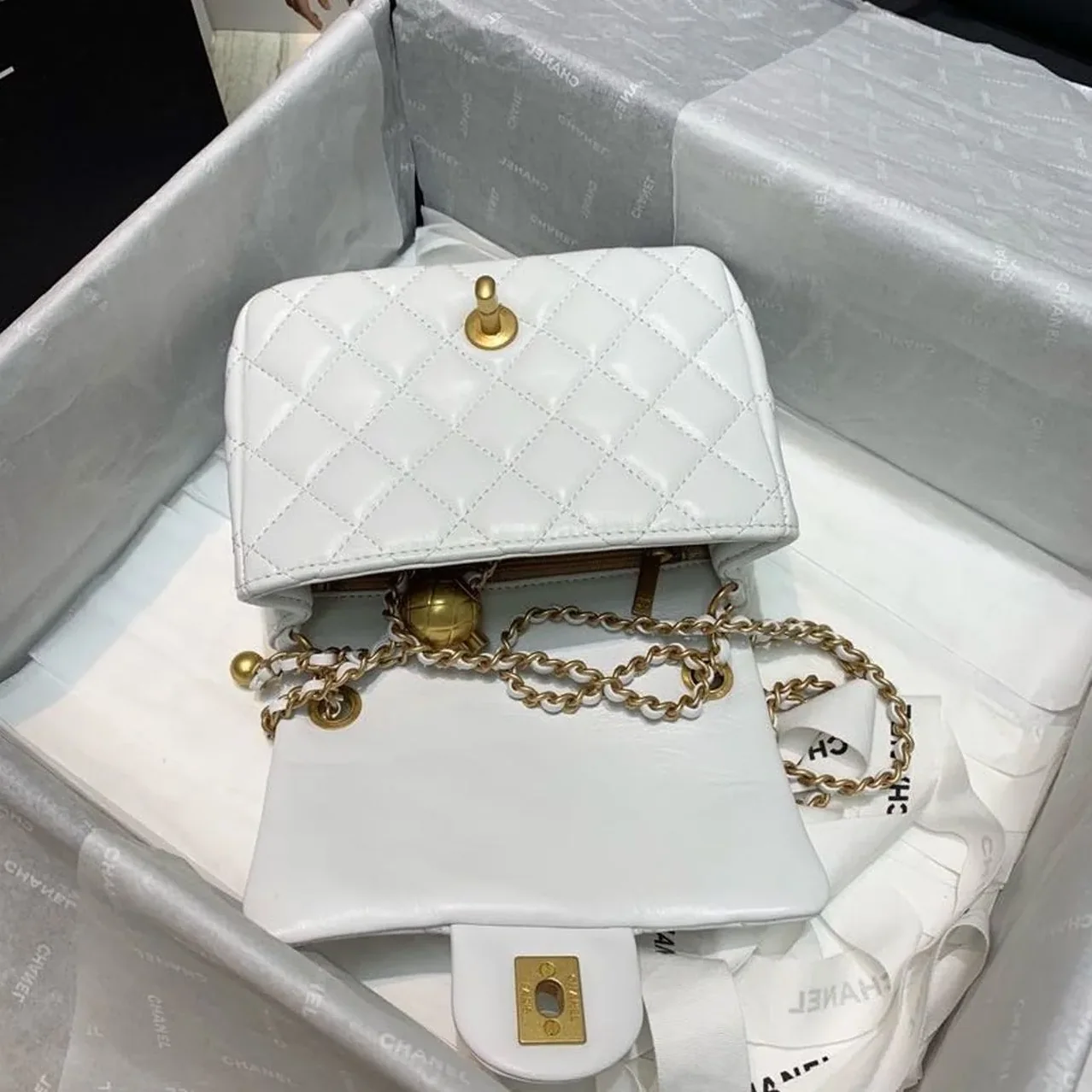 Chanel Flap Bag With CC Ball On Strap Mini Crossbody in White Gold Hardware Chanel Flap Bag With CC Ball On Strap Mini Crossbody in White Gold Hardware