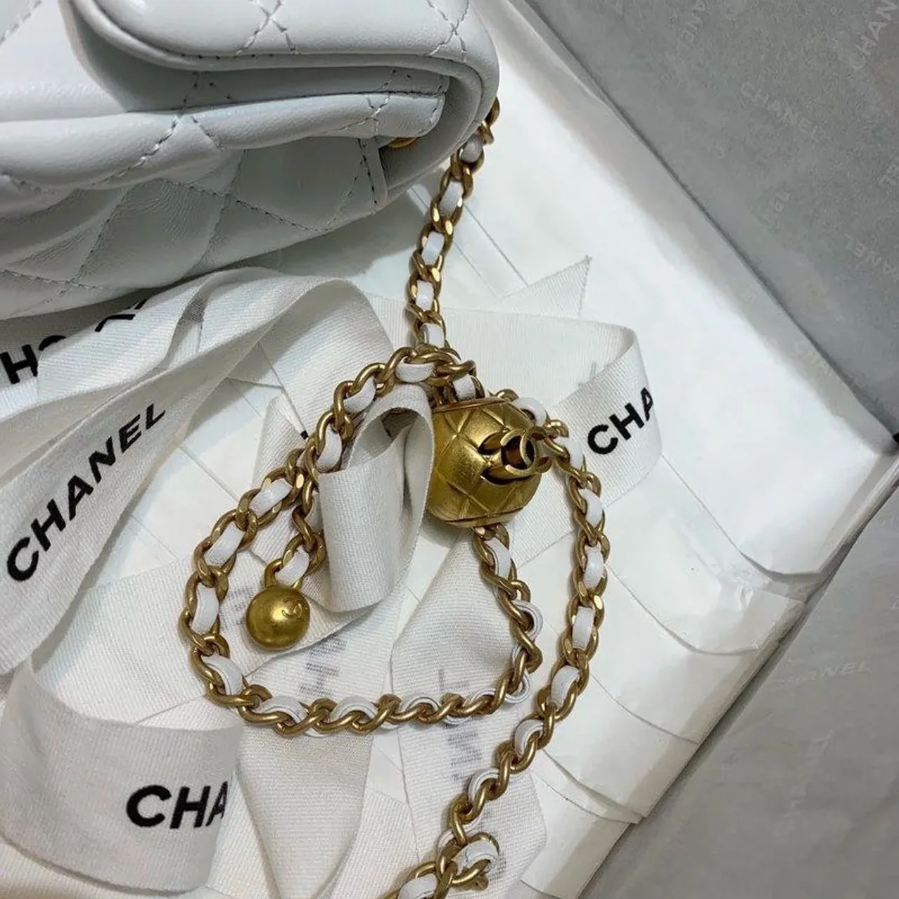 Chanel Flap Bag With CC Ball On Strap Mini Crossbody in White Gold Hardware Chanel Flap Bag With CC Ball On Strap Mini Crossbody in White Gold Hardware