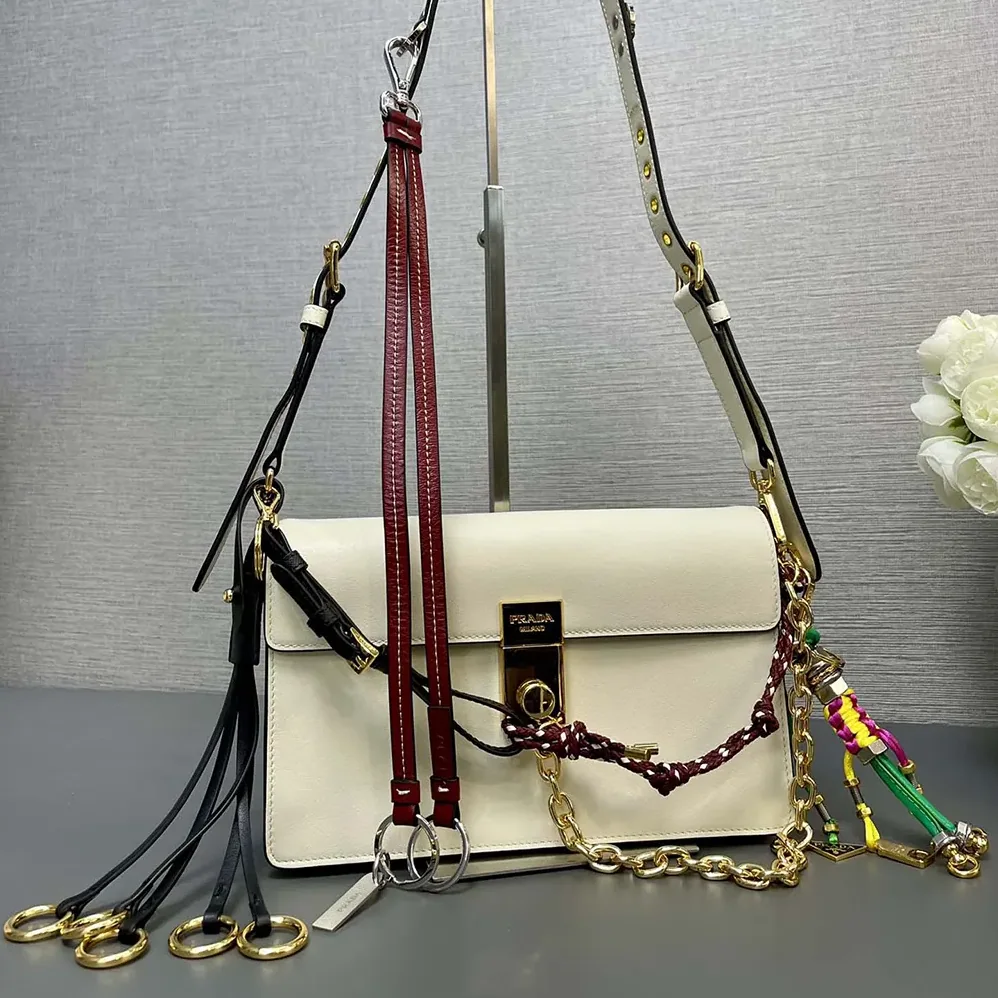 Prada Soft Sound Small Leather Shoulder Bag with Charms for Women in White Prada Soft Sound Small Leather Shoulder Bag with Charms for Women in White