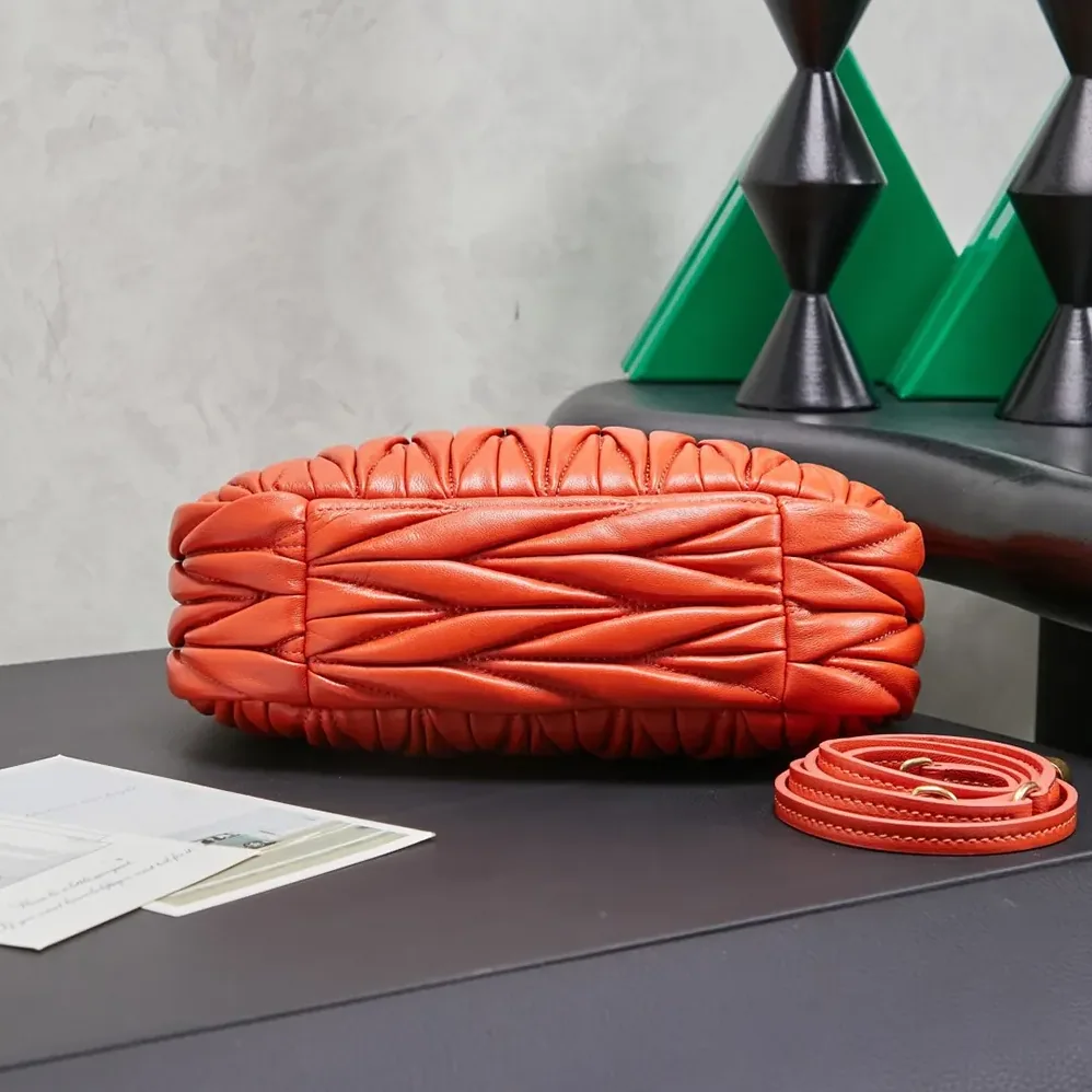 Miu Miu Wander Matelassé Nappa Leather Hobo Bag for Women in Orange Miu Miu Wander Matelassé Nappa Leather Hobo Bag for Women in Orange