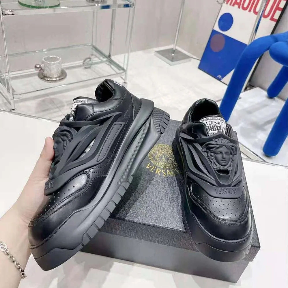 Versace Odissea Sneakers are Set on Rubber Soles with Perforated Toe Caps for Unisex in Black Versace Odissea Sneakers are Set on Rubber Soles with Perforated Toe Caps for Unisex in Black