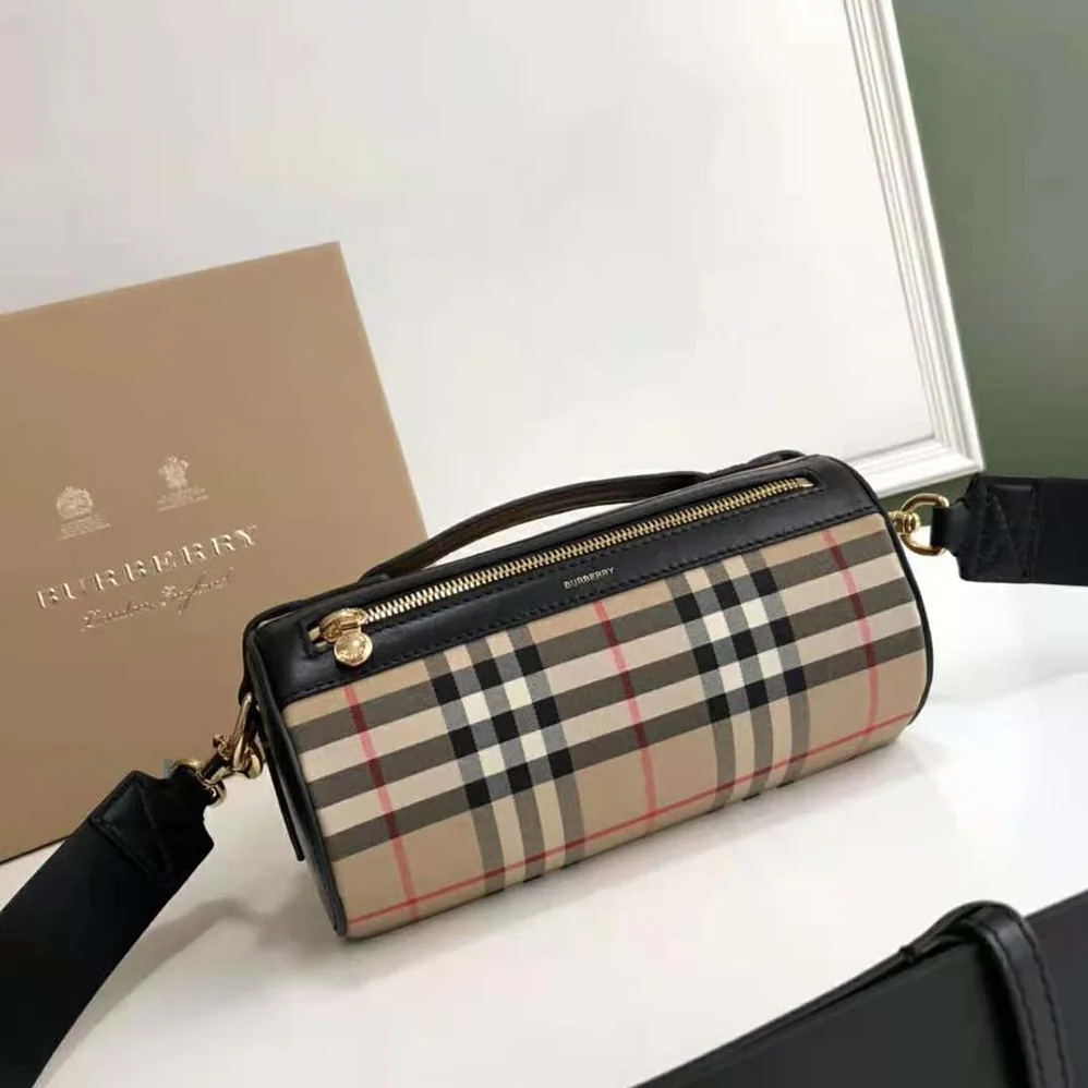 Burberry The Icon Stripe E-canvas and Leather Barrel Bag for Women in Brown Burberry The Icon Stripe E-canvas and Leather Barrel Bag for Women in Brown