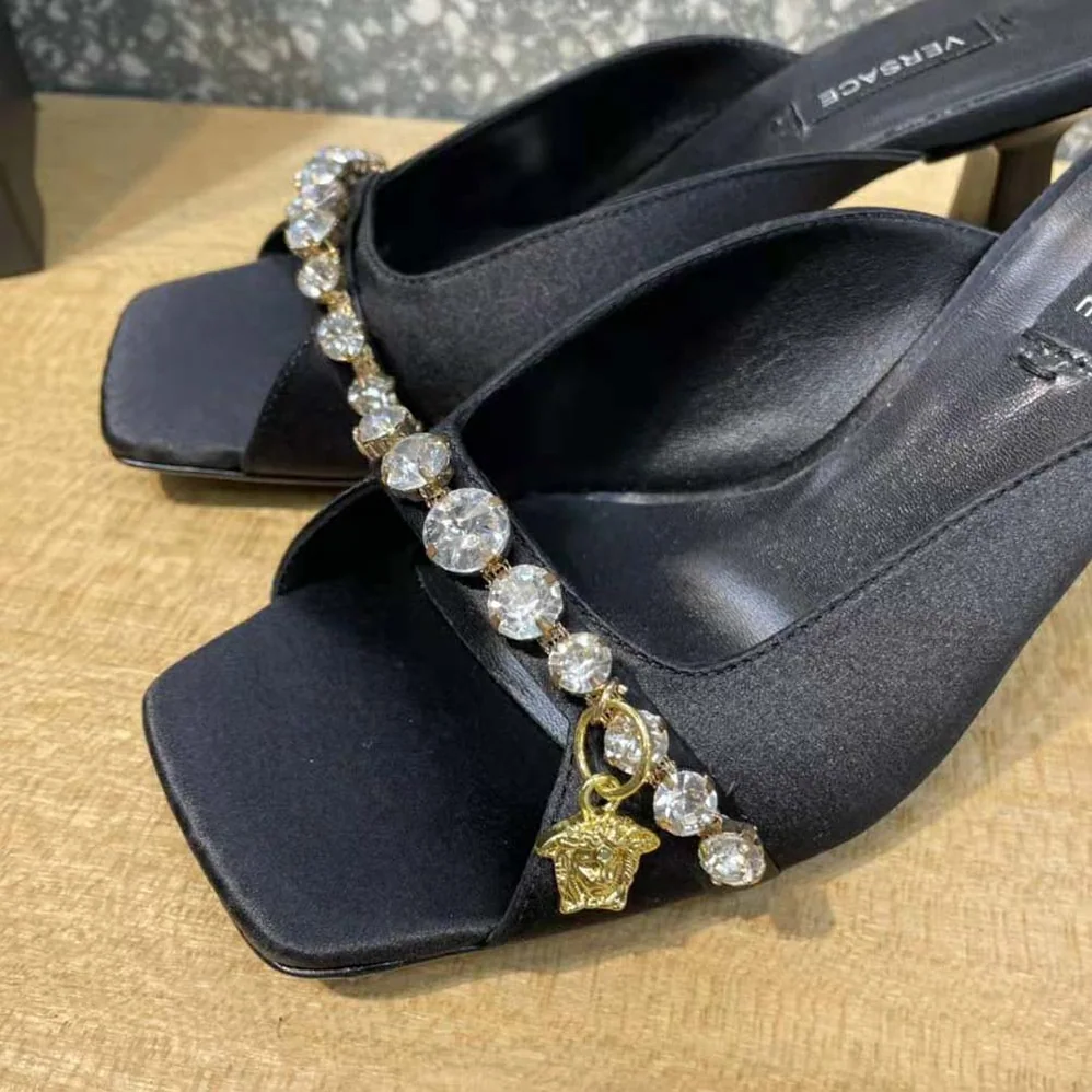 Versace Artifact Mid-Heel Mules for Women in Black Versace Artifact Mid-Heel Mules for Women in Black