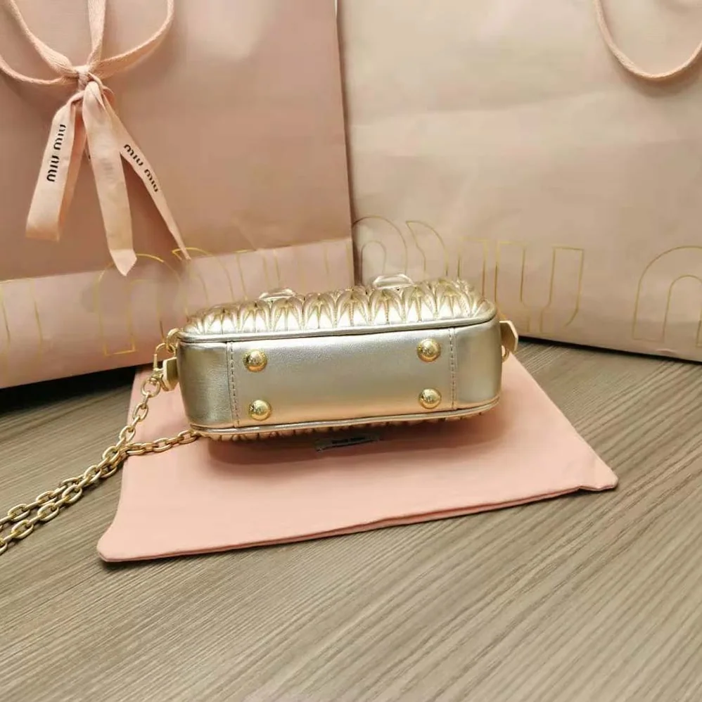 Miu Miu Matelassé Nappa Leather Top-Handle Mini-Bag for Women in Gold