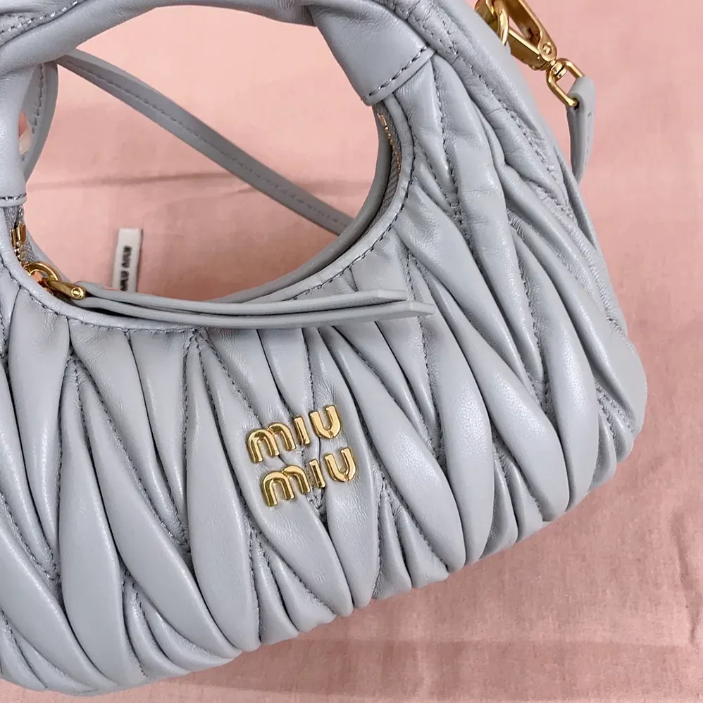 Miu Miu Wander Matelassé Nappa Leather Hobo Mini-Bag for Women in Powder Blue Miu Miu Wander Matelassé Nappa Leather Hobo Mini-Bag for Women in Powder Blue