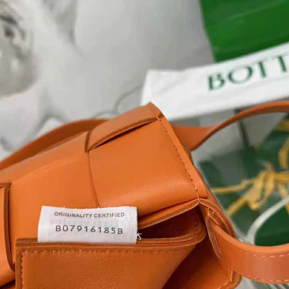 Bottega Veneta Cassette Intreccio Leather Cross-Body Bag for Women in Orange Bottega Veneta Cassette Intreccio Leather Cross-Body Bag for Women in Orange