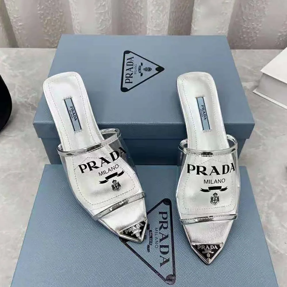 Prada Logo-Print Plexiglas Slides for Women in Silver Prada Logo-Print Plexiglas Slides for Women in Silver