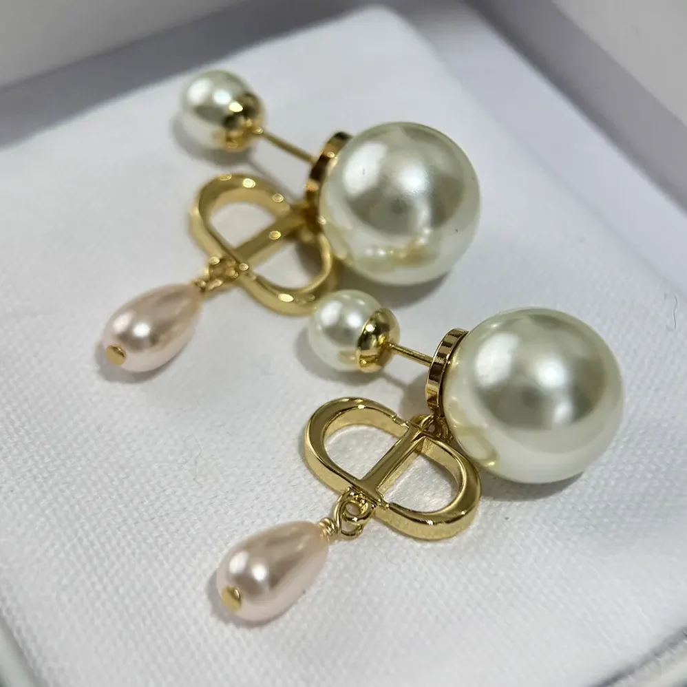 Dior Petit CD Earrings Gold-Finish Metal and Iridescent Pink Resin Pearls for Women Dior Petit CD Earrings Gold-Finish Metal and Iridescent Pink Resin Pearls for Women
