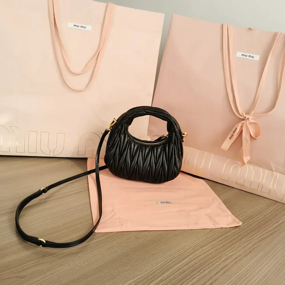 Miu Miu Wander Matelassé Nappa Leather Hobo Mini-Bag for Women in Black Miu Miu Wander Matelassé Nappa Leather Hobo Mini-Bag for Women in Black
