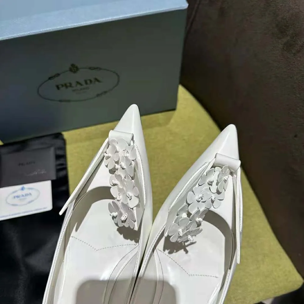 Prada Brushed Leather Pumps with Floral Appliqués for Women in White