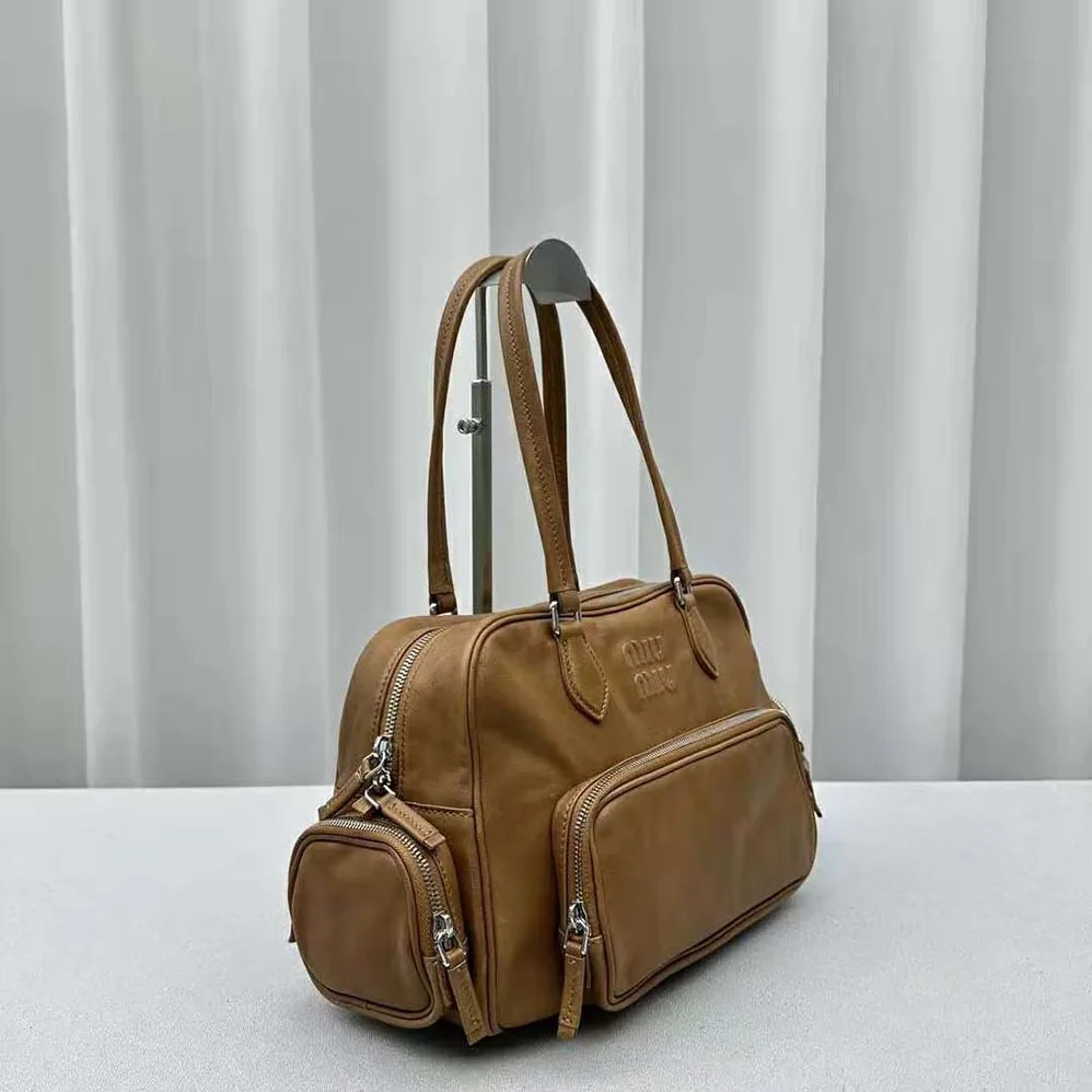 Miu Miu Nappa Leather Top-handle Bag with Embossed Lettering Logo for Women in Brown