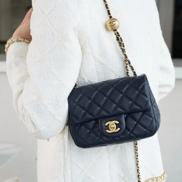 Chanel Flap Bag With CC Ball On Strap Small Crossbody in Black Gold Hardware