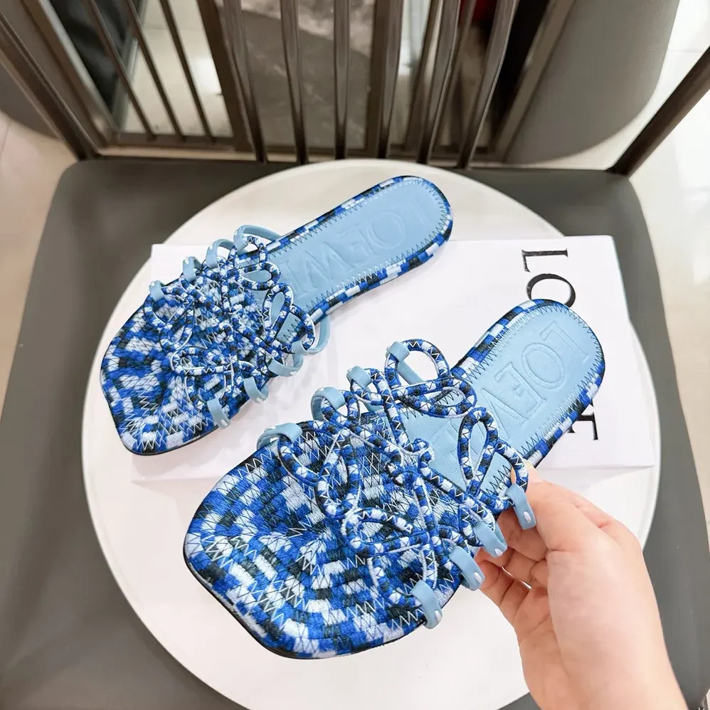 Loewe Petal Anagram Slide in Embroidered Canvas for Women in Baby Blue Loewe Petal Anagram Slide in Embroidered Canvas for Women in Baby Blue