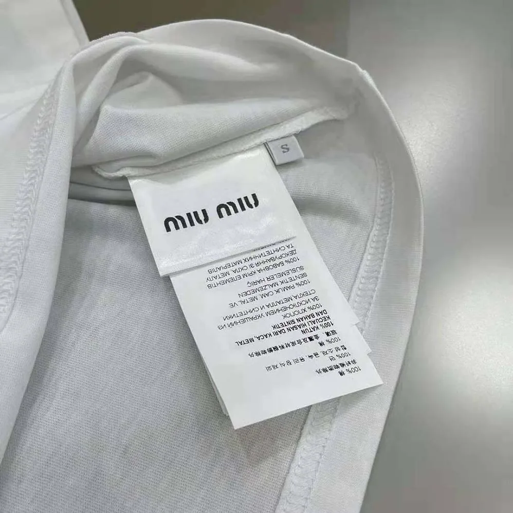 Miu Miu Embroidered Cotton T-shirt with Logo Patch for Women in White Miu Miu Embroidered Cotton T-shirt with Logo Patch for Women in White