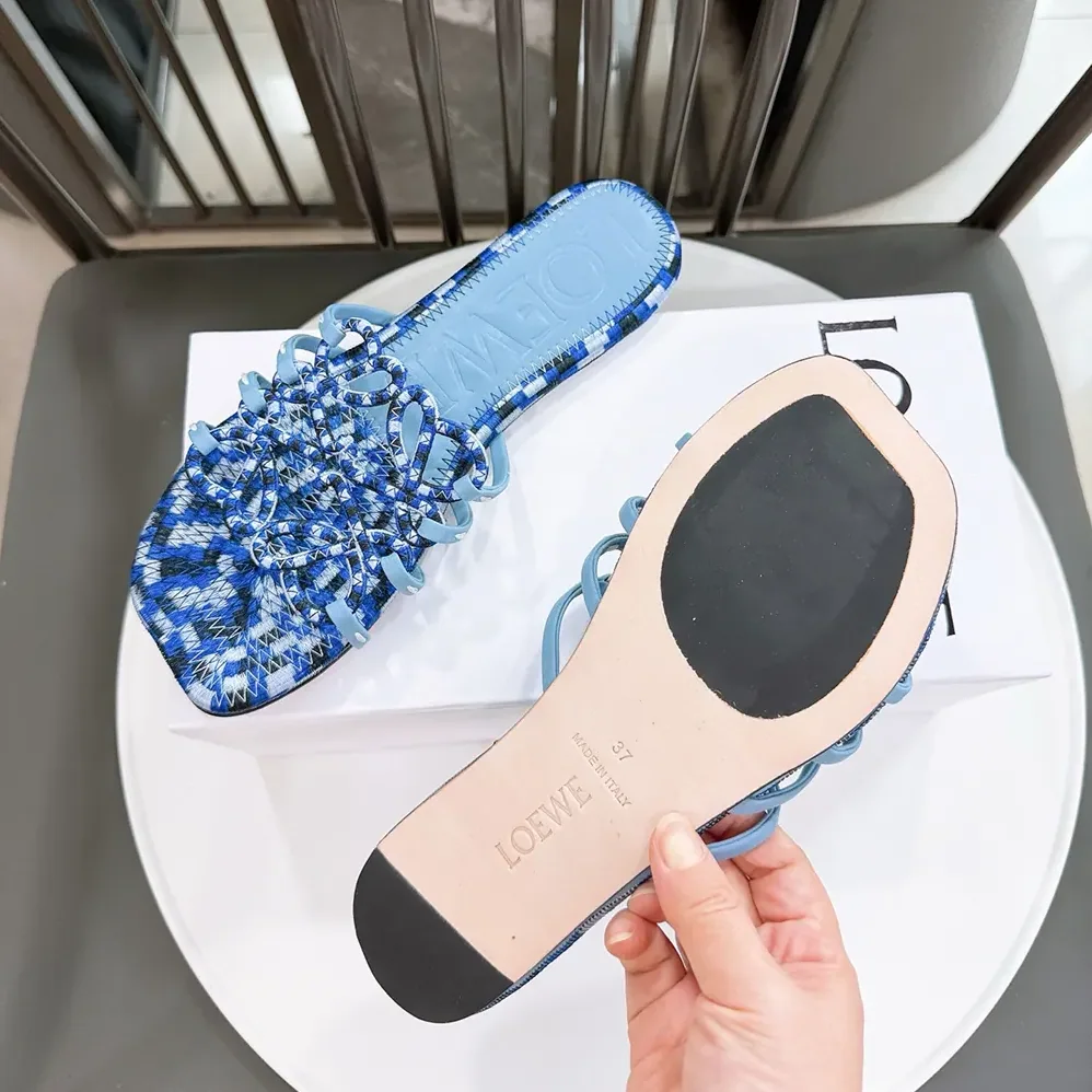 Loewe Petal Anagram Slide in Embroidered Canvas for Women in Baby Blue Loewe Petal Anagram Slide in Embroidered Canvas for Women in Baby Blue