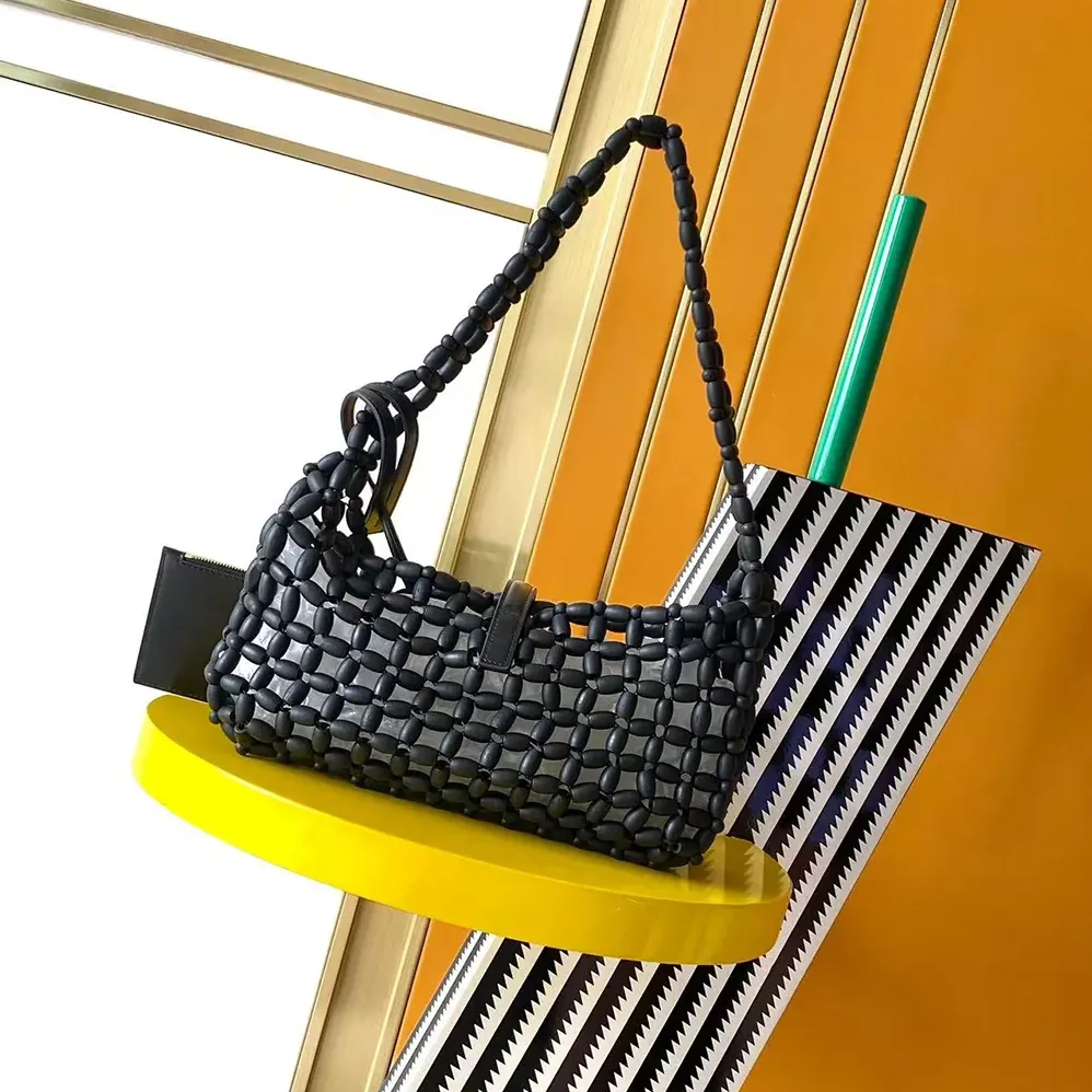 Saint Laurent YSL Le 5 À 7 In Wood Beads for Women in Black Saint Laurent YSL Le 5 À 7 In Wood Beads for Women in Black