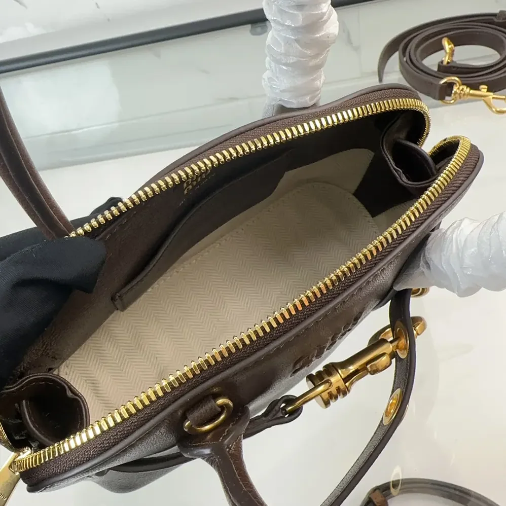 Miu Miu Aventure Nappa Leather Top-handle Bag for Women in Bordeaux Miu Miu Aventure Nappa Leather Top-handle Bag for Women in Bordeaux