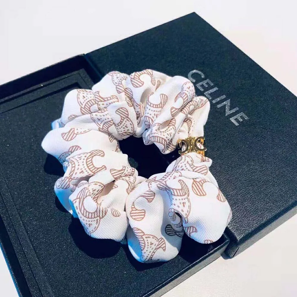 Celine Scrunchy Celine Triomphe Monogram Bracelet in Brass with Gold Finish and White Silk for Women Celine Scrunchy Celine Triomphe Monogram Bracelet in Brass with Gold Finish and White Silk for Women