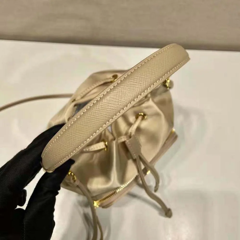 Prada Duet Re-Nylon Bucket Bag for Women in Beige