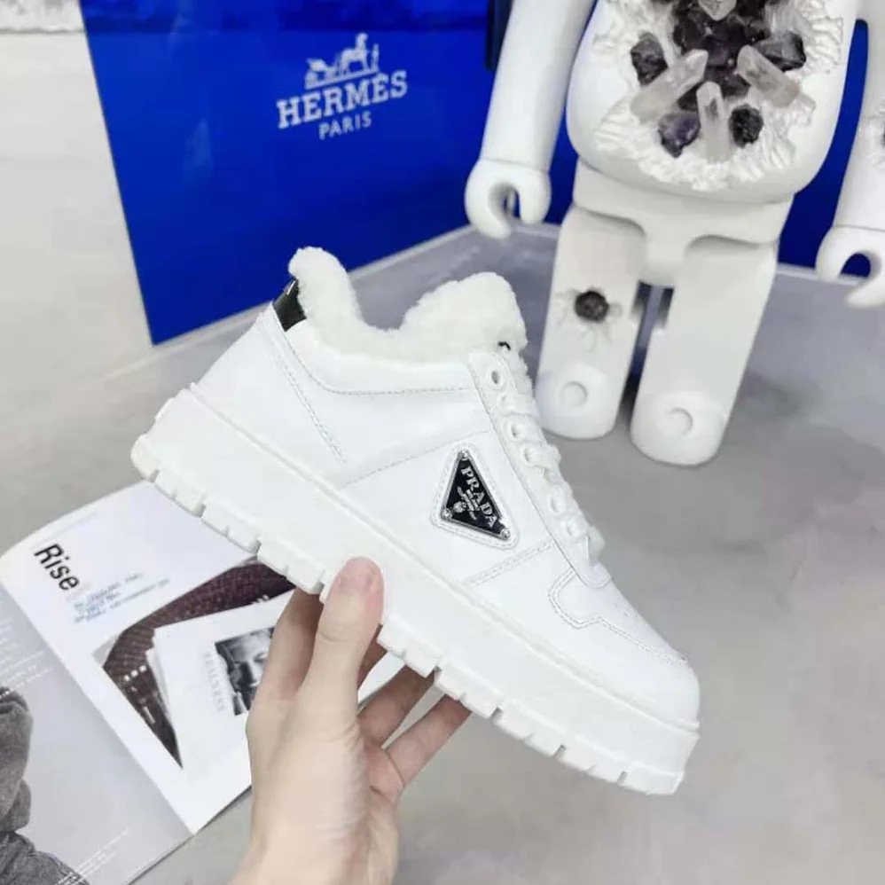 Prada Leather and Shearling Sneakers for Women in White