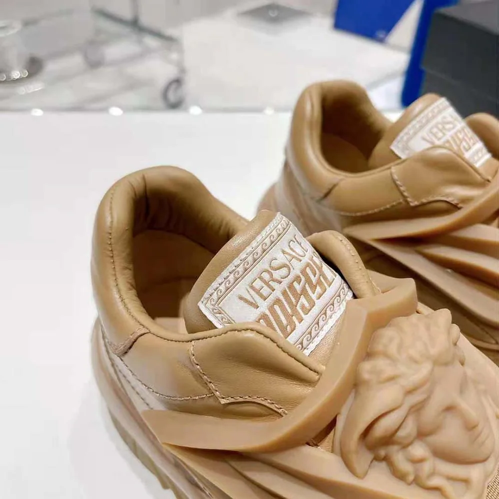 Versace Odissea Sneakers are Set on Rubber Soles with Perforated Toe Caps for Unisex in Brown Versace Odissea Sneakers are Set on Rubber Soles with Perforated Toe Caps for Unisex in Brown