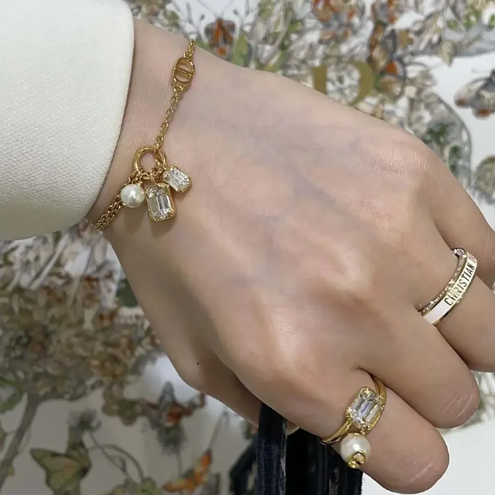 Dior Petit CD Bracelet Gold-Finish Metal with a White Resin Pearl and Silver for Women in Tone Crystals Dior Petit CD Bracelet Gold-Finish Metal with a White Resin Pearl and Silver for Women in Tone Crystals