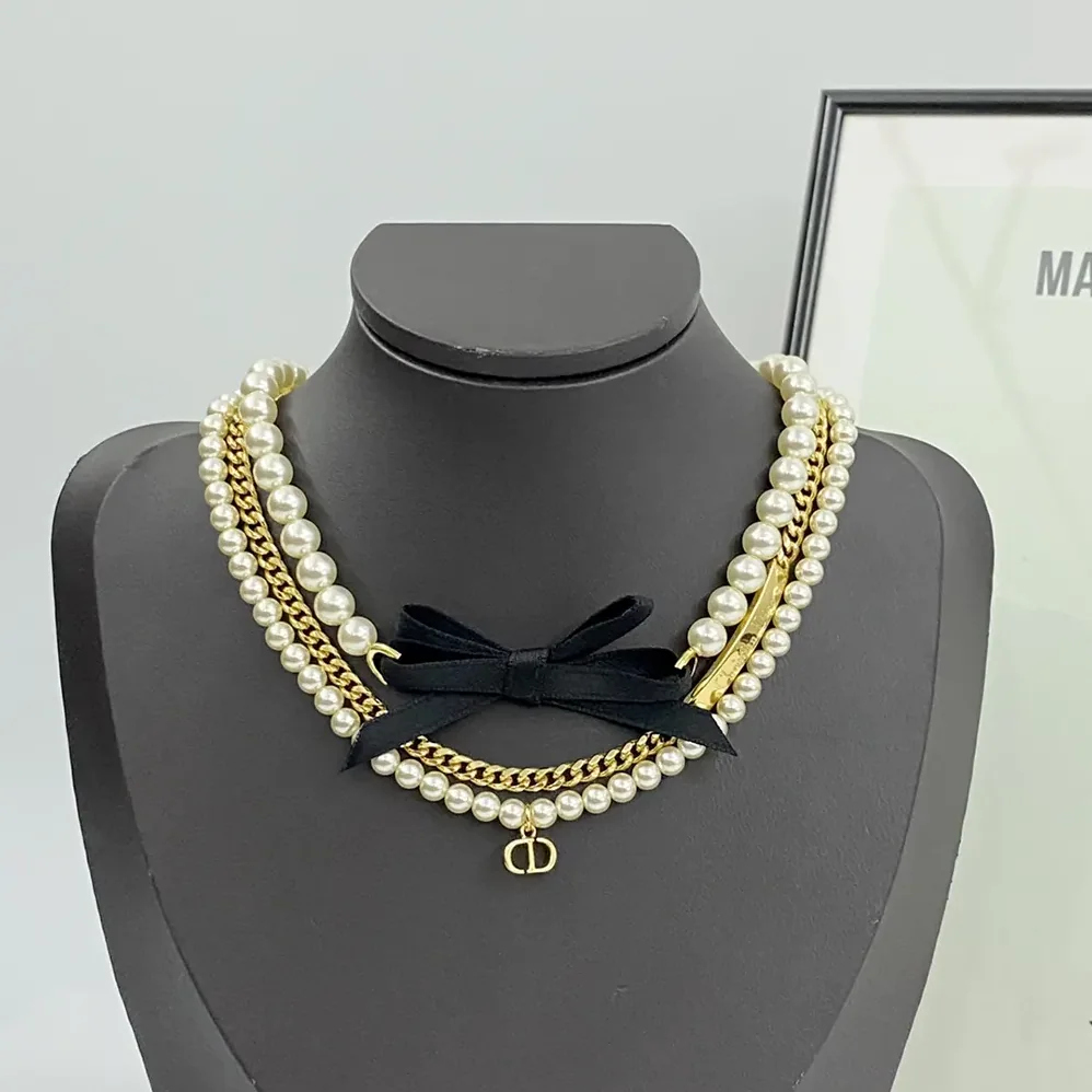 Dior Le Nœud de Dior Choker Gold-Finish Metal with White Resin Pearls and Black Satin for Women Dior Le Nœud de Dior Choker Gold-Finish Metal with White Resin Pearls and Black Satin for Women