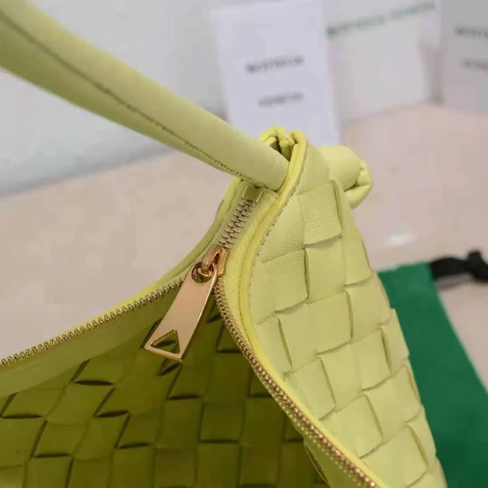 Bottega Veneta Turn Medium Intrecciato Leather Pouch with Adjustable Strap for Women in Yellow Bottega Veneta Turn Medium Intrecciato Leather Pouch with Adjustable Strap for Women in Yellow