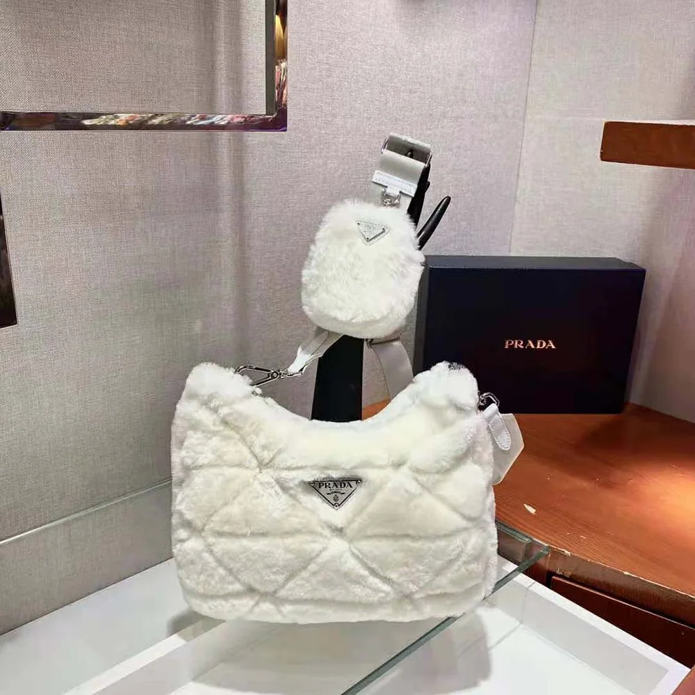 Prada A Patchwork-style Triangle Motif Characterizes Shearling Shoulder Bag for Women Prada A Patchwork-style Triangle Motif Characterizes Shearling Shoulder Bag for Women
