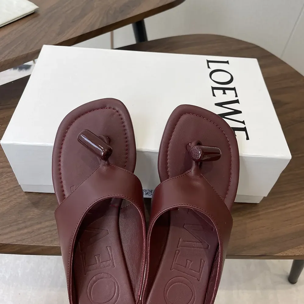 Loewe Toggle Flat Sandal in Shiny Smoot Calfskin for Women in Burnt Red Loewe Toggle Flat Sandal in Shiny Smoot Calfskin for Women in Burnt Red