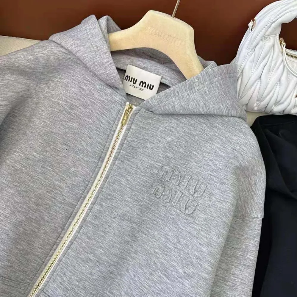 Miu Miu Embroidered Cotton Fleece Hoodie with Embroidered Logo for Women in Silver Miu Miu Embroidered Cotton Fleece Hoodie with Embroidered Logo for Women in Silver