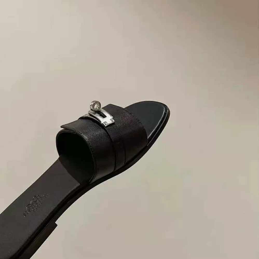 Hermes Giulia Sandal in Calfskin with Iconic Palladium-Plated Kelly Buckle for Women in Black Hermes Giulia Sandal in Calfskin with Iconic Palladium-Plated Kelly Buckle for Women in Black
