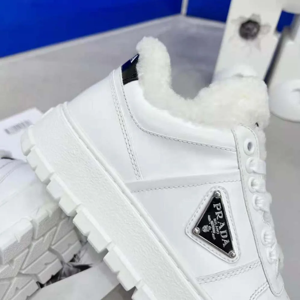 Prada Leather and Shearling Sneakers for Women in White
